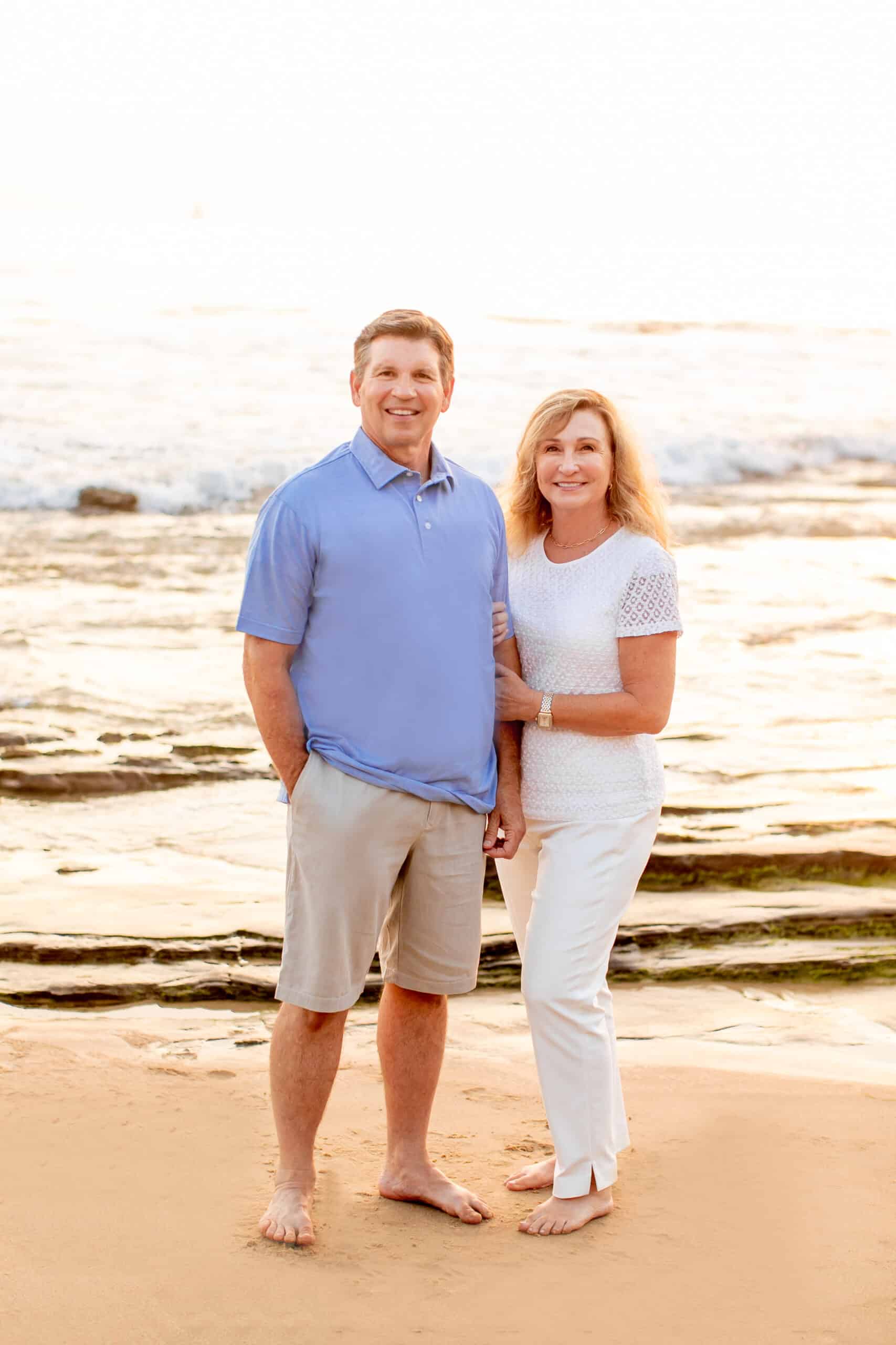 Lee Dove and his wife standing on the beach.